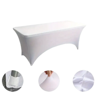 White stretchfit table cover for trendy black spandex tables at Fiesta event