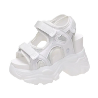 White platform sandal with velcro straps.
