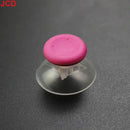 Pink joystick cap with clear suction cup.