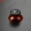 Red and black joystick.
