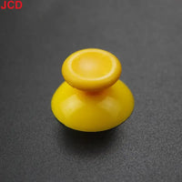 Yellow plastic joystick cap.