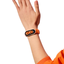 Orange smart band on wrist.