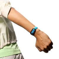 Blue fitness tracker on wrist.