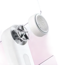 White lint remover with exposed blades.