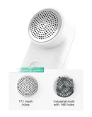 White lint remover with mesh holes.