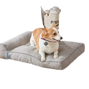 Gray pet bed with a bolster.