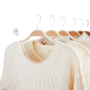 Clothes hanging in a wardrobe.