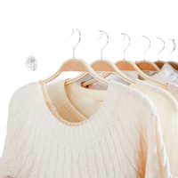 Clothes hanging in a wardrobe.