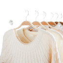 Clothes hanging in a wardrobe.
