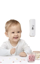 Baby near temperature and humidity sensor.