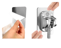 Adhesive shower head holder.