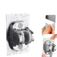 Chrome shower head holder with adhesive backing.