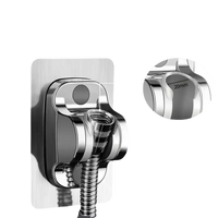 Chrome shower head holder with adhesive mount.