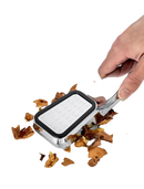 Chrome nutcracker with walnut shells.