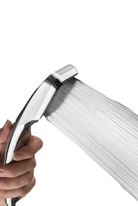 Chrome shower head with pressurized water flow.