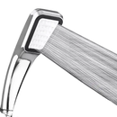 Chrome shower head with water flowing.