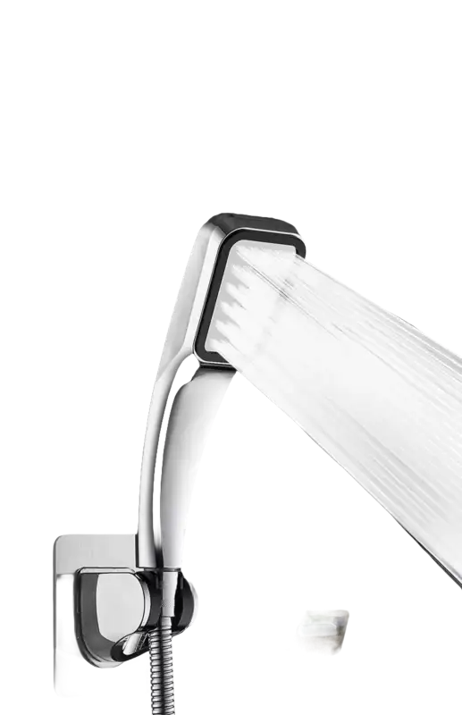 Chrome shower head with water flowing.
