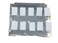Gray storage organizer with white labels in plastic packaging.
