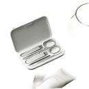 Open manicure set in a white case.