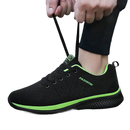 Black and green fashion sneaker.